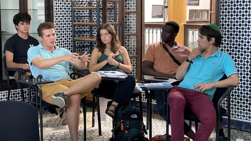 Students discussing contemporary issues in Morocco