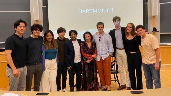 Hoda Barakat standing alongside Dartmouth students in a classroom